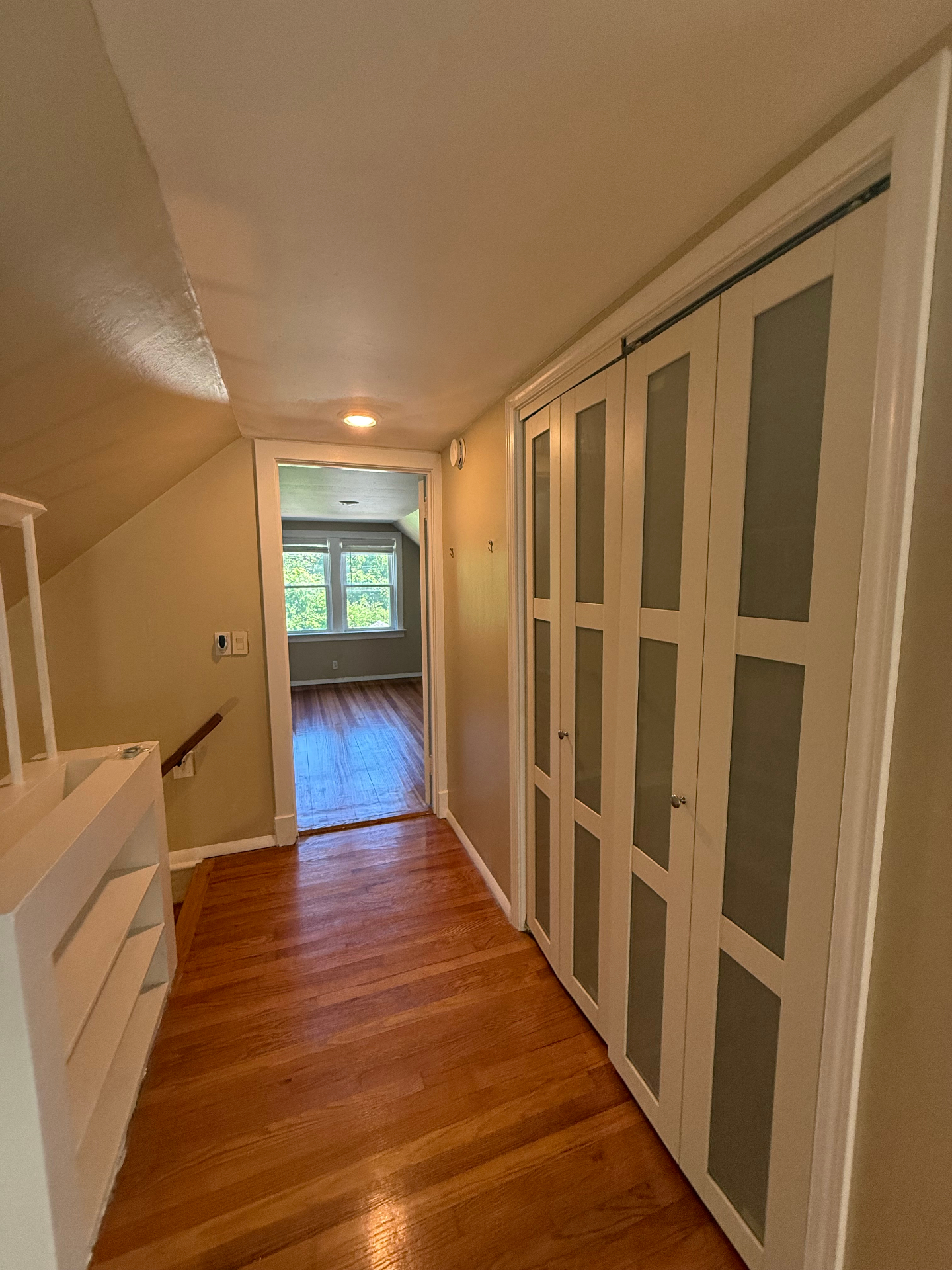 Upstairs hall with built-in closet doors
