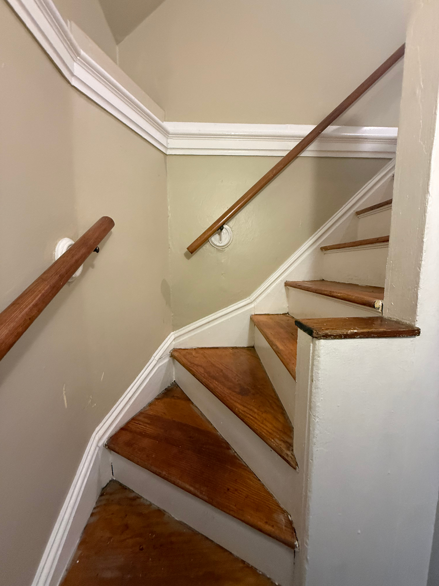 Stair landing with handrails