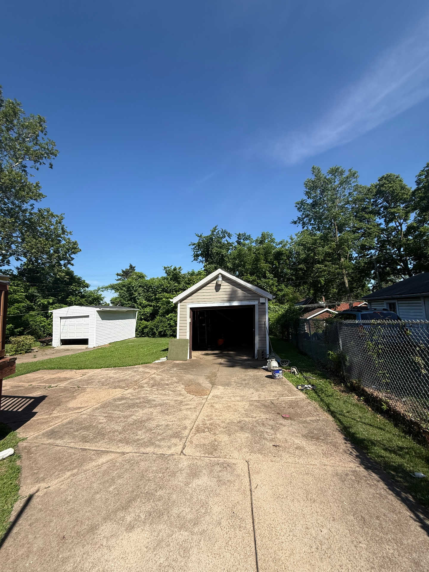Detached single-car garage and long driveway