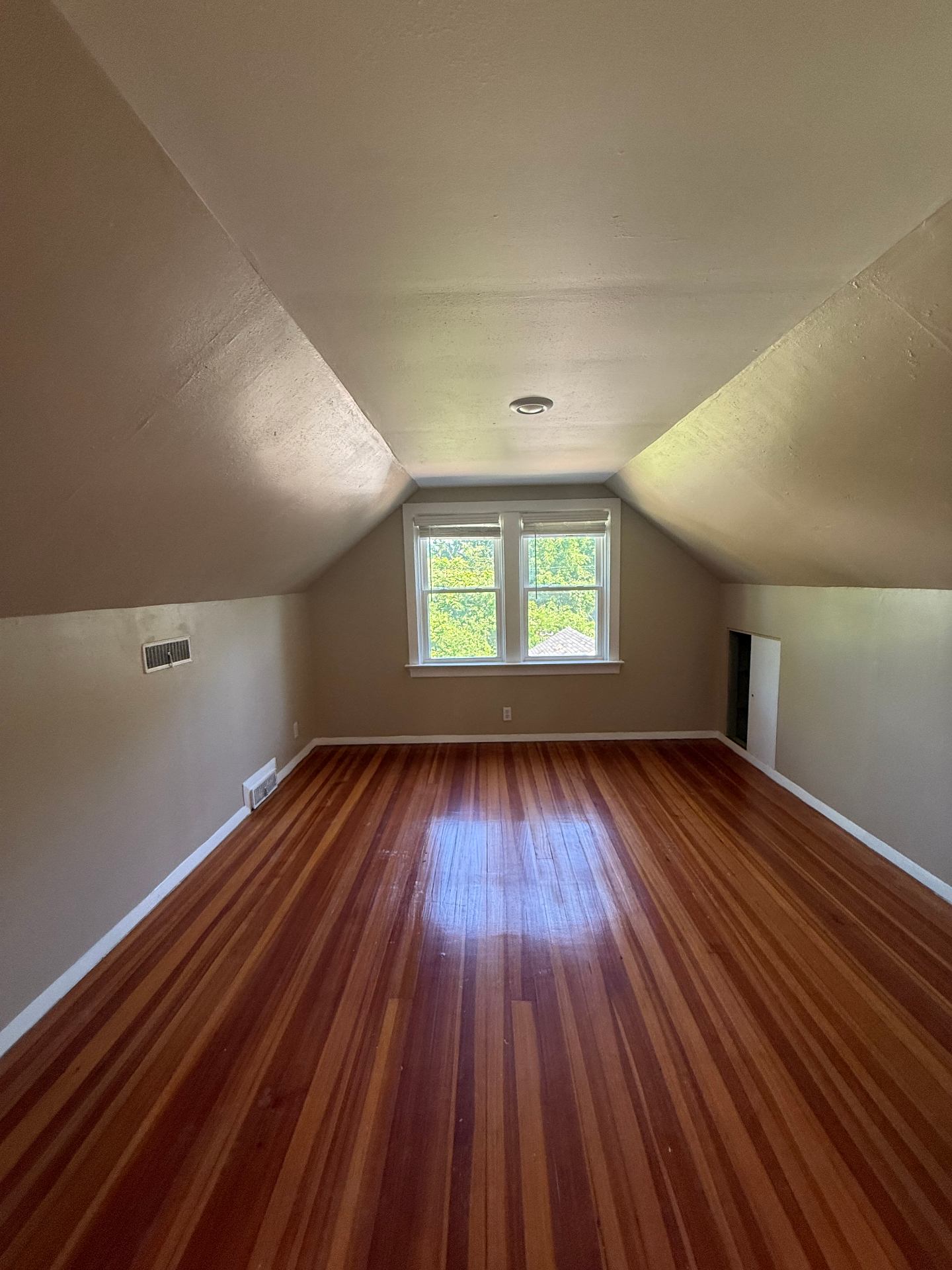 Upstairs bedroom with sloped ceilings