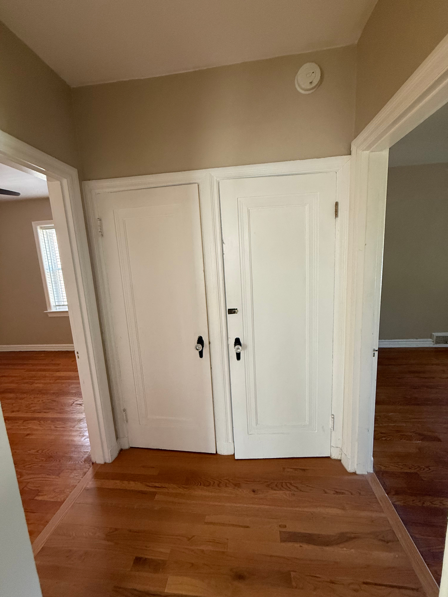 Hallway junction with bedroom, attic, basement access