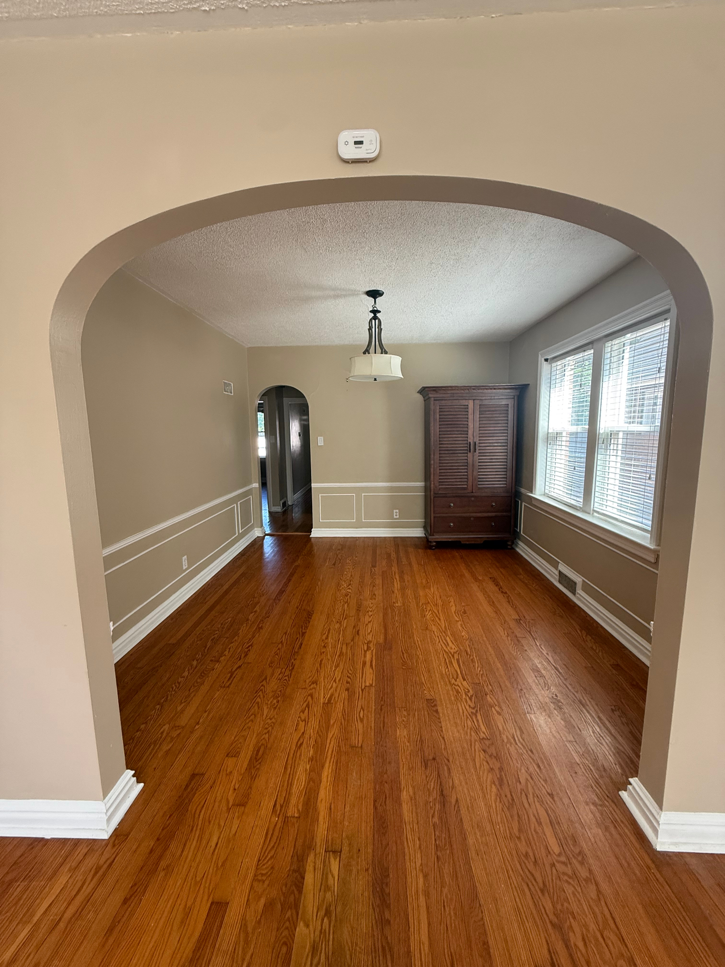 Dining room through arched entryway
