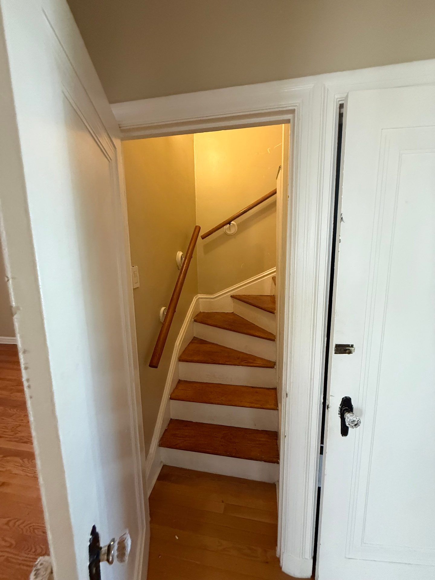 Open door revealing stairs to the second floor